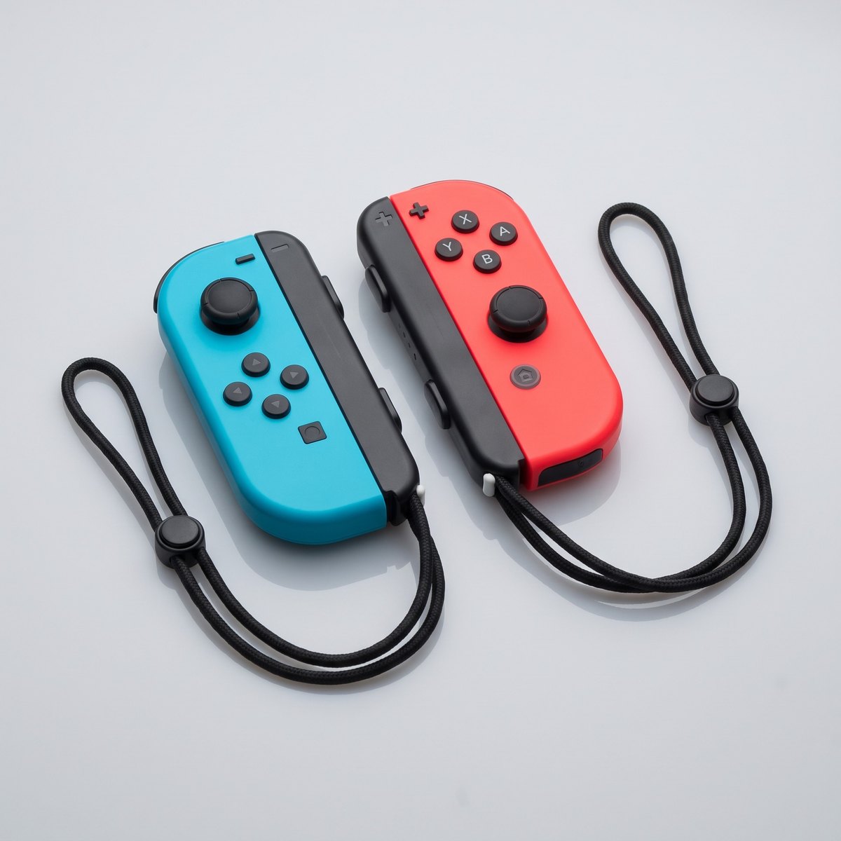 Joy-Con originales de Nintendo Switch con correas